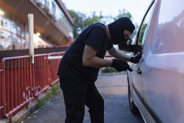 burglar breaking into van to steal it and contents